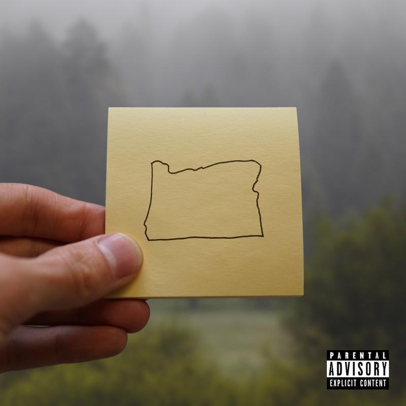 Letter to Ashland cover art: picture of Oregon drawn on post-it note in front of lush forest