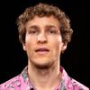 Made It There cover art: studio photo of Dylan Hand wearing pink alligator shirt and rather blank expression
